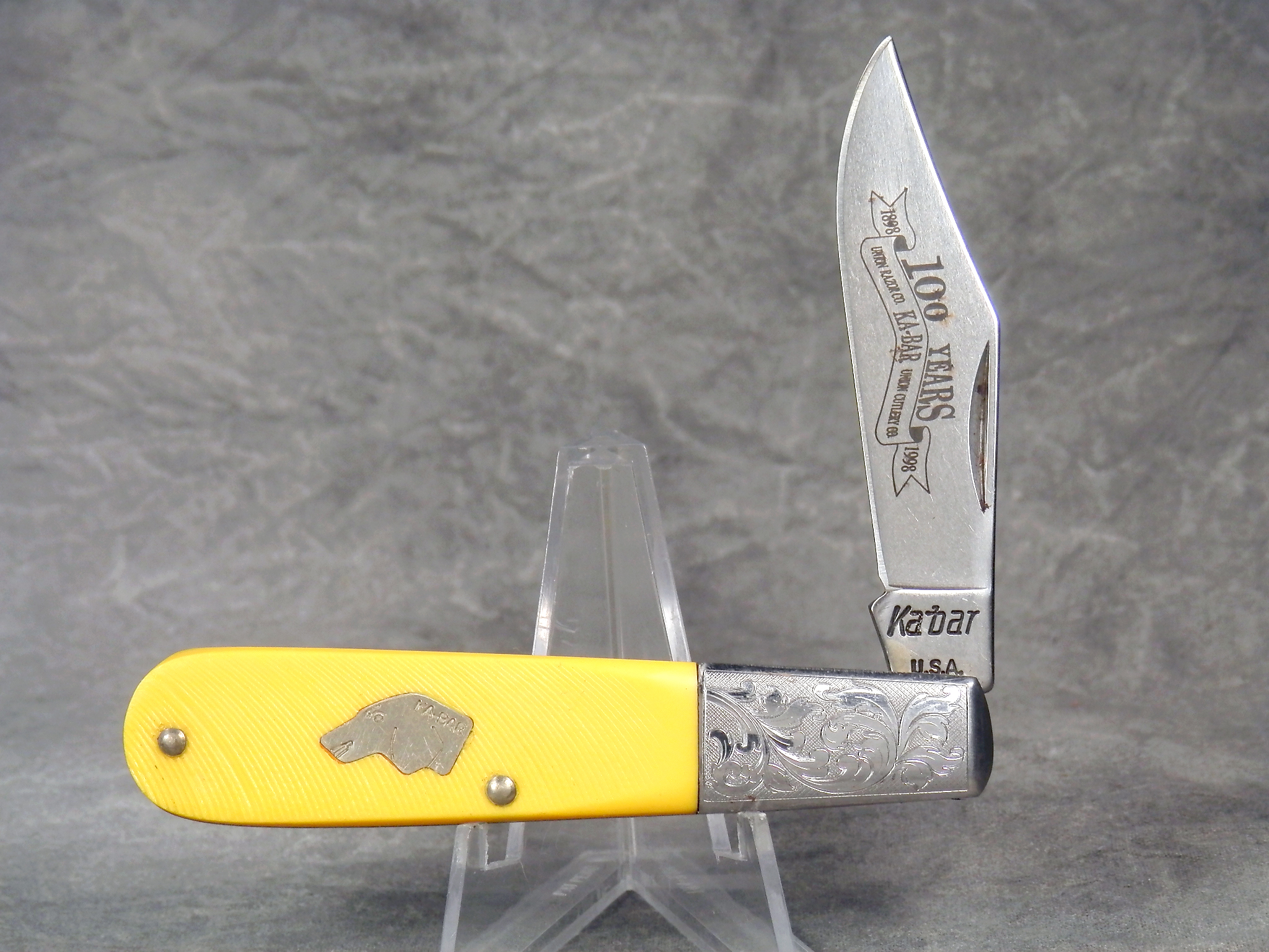 How much is 1998 KABAR Yellow Sawcut 100th Anniversary Barlow worth