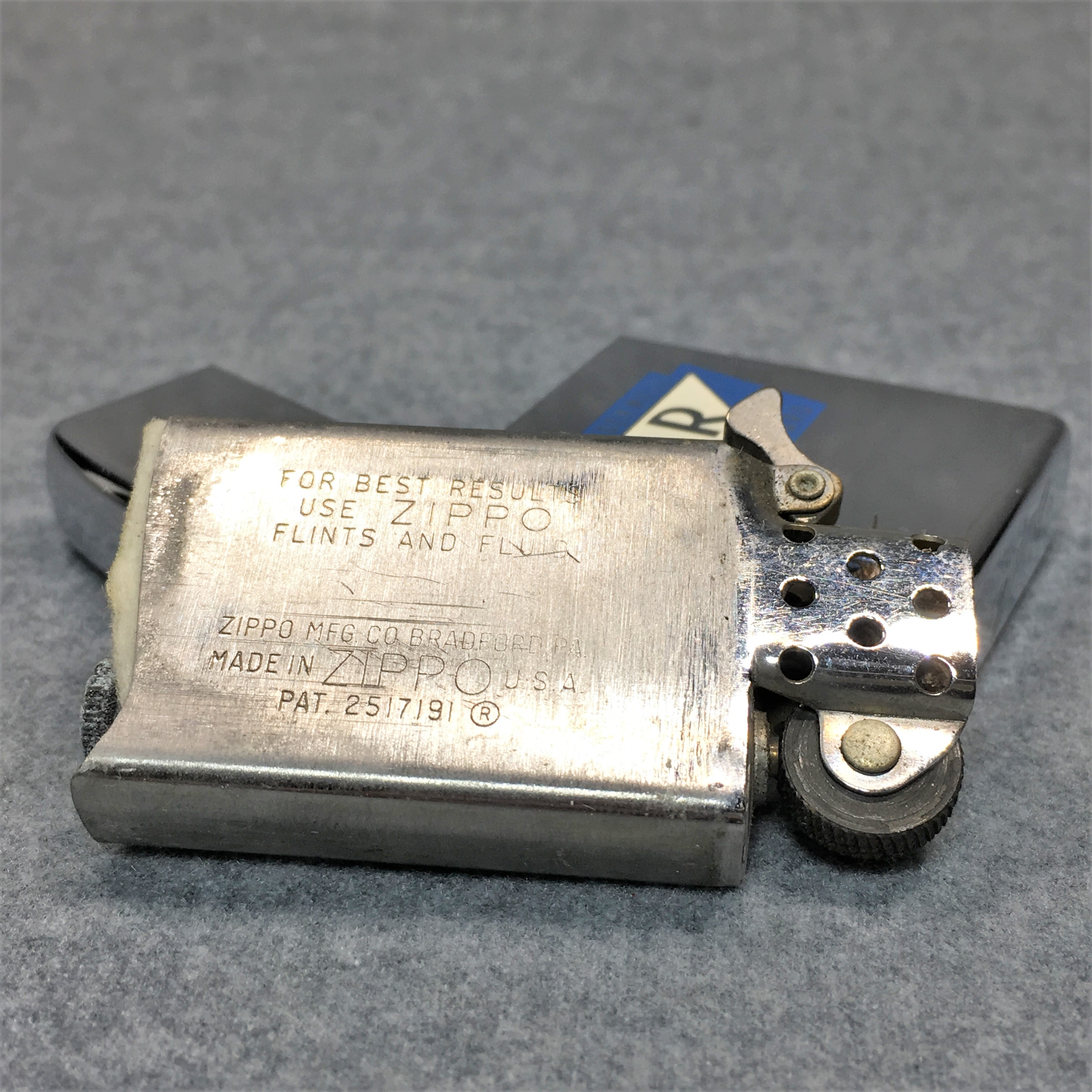 How much is Vintage ROCKWELL STANDARD Polished Chrome Slim Advertising  Lighter (Zippo 1965) worth? | iGuide.net Price Report